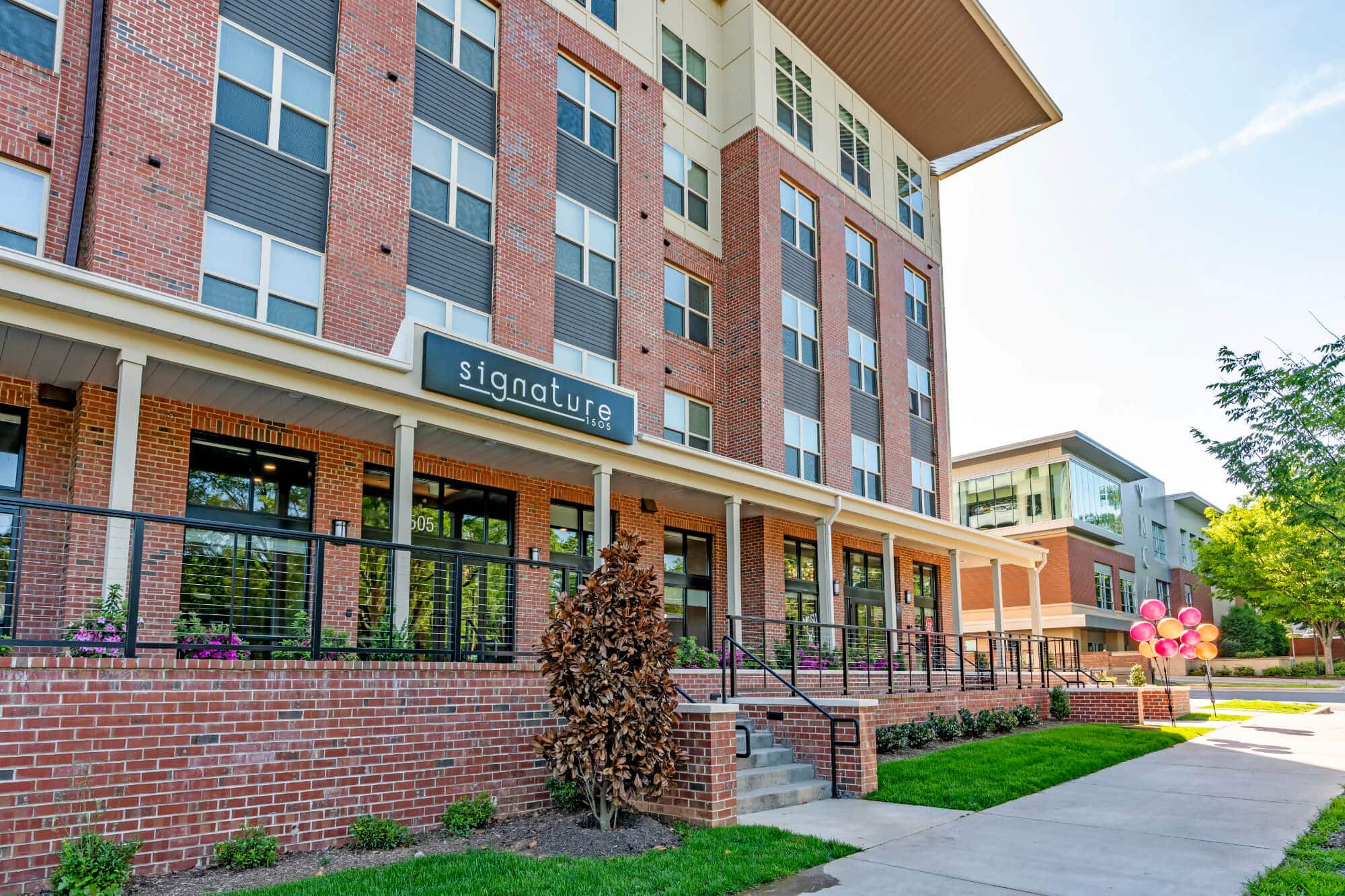 signature 1505 off campus apartments near nc state university building exterior