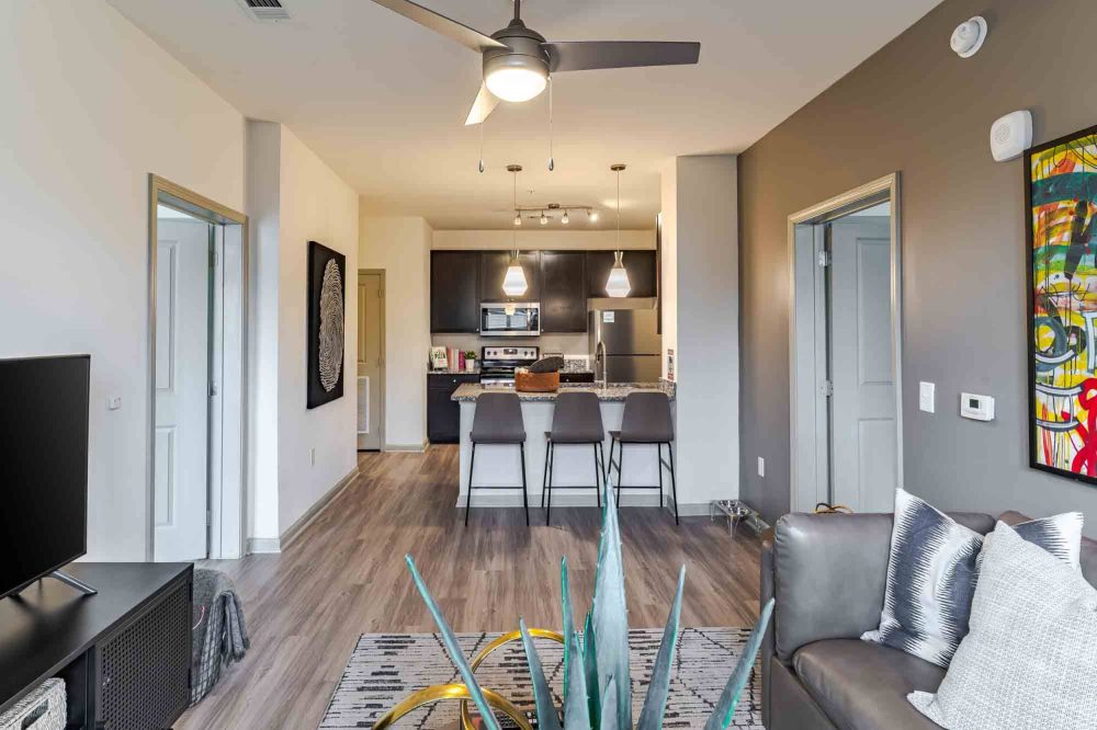 signature 1505 apartments near nc state spacious living room kitchen bar seating